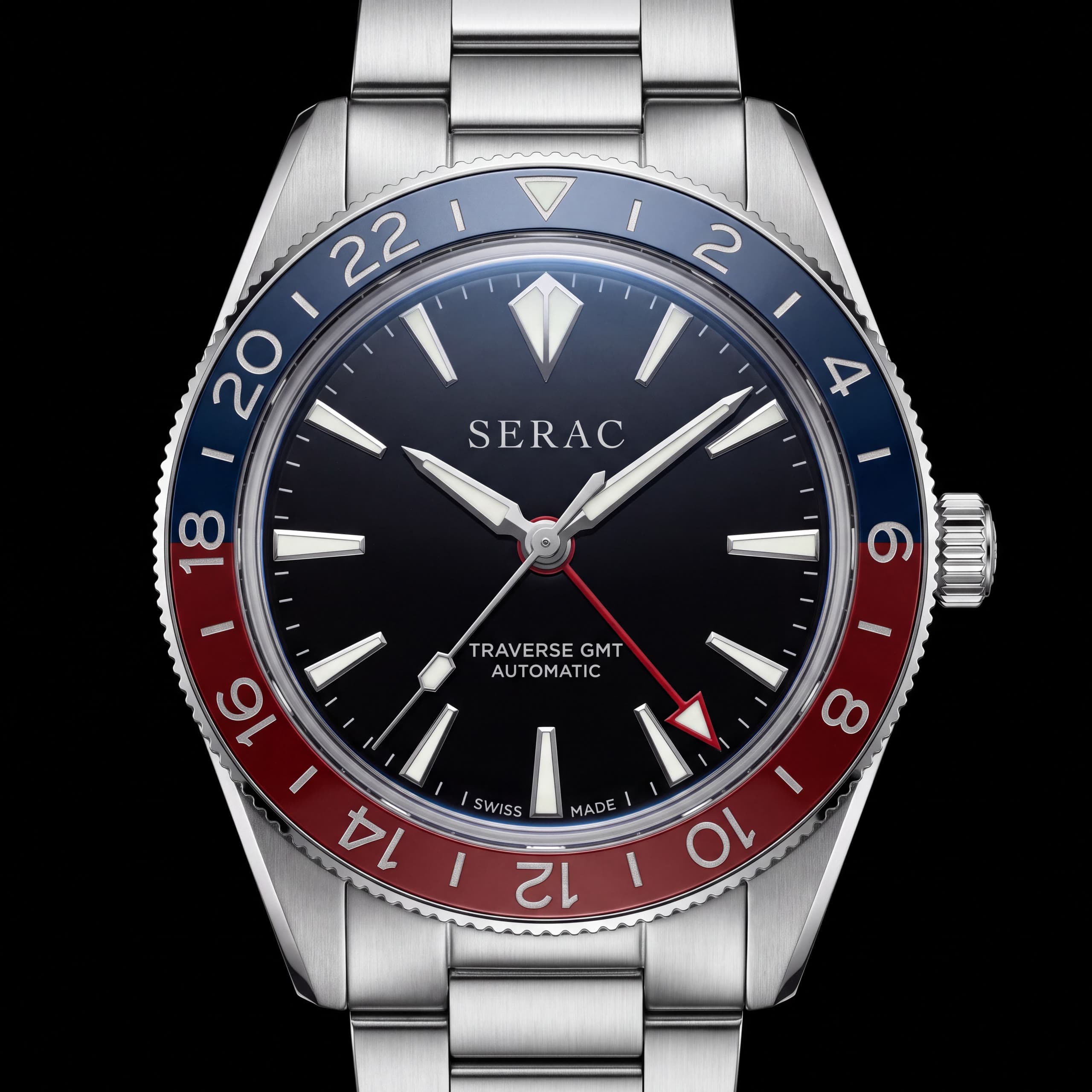 The Traverse GMT front-on under studio light; hold to switch the light off and see the lume.